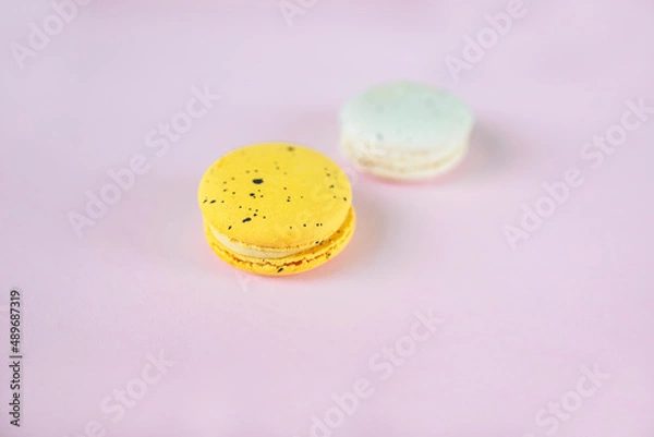 Obraz Two macaroons on pink background, french dessert, easter gift