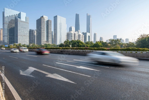 Fototapeta Cars driving at high speeds on the skyline and highways of Guangzhou, China