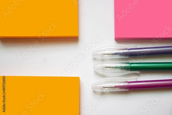 Fototapeta White sheet of paper with a fountain pen and ink on a blue background, mock up