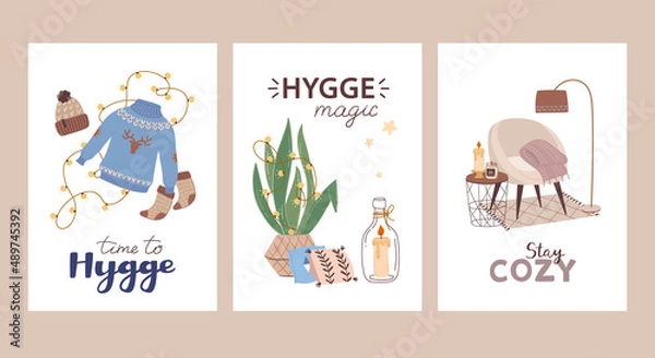Fototapeta Set of cozy cards on hygge theme. Postcards with warm knitted clothes, pillows and candles, an easy chair and a plaid. Vector posters in flat style with cute lettering