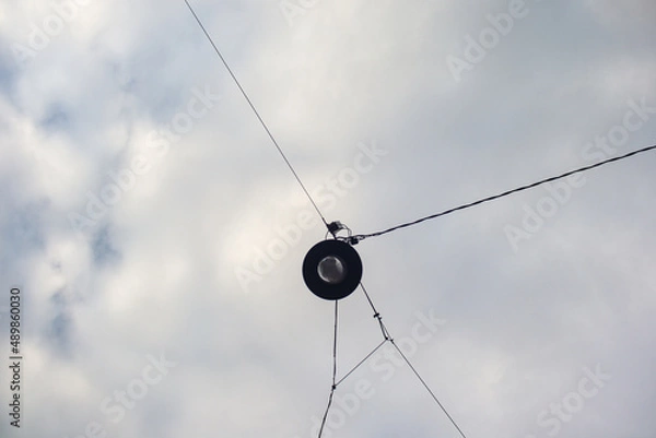 Fototapeta Cables and light in the sky