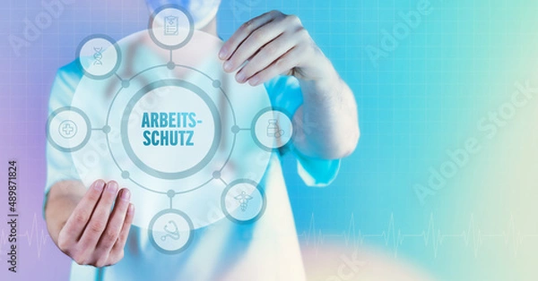 Fototapeta Arbeitsschutz (Arbeitssicherheit). Medizin in der Zukunft. Arzt hält virtuelles Interface mit Text und Icons im Kreis.