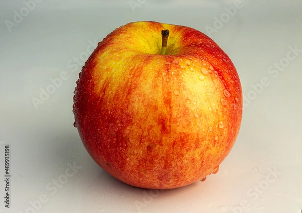 Obraz Red apple close-up on a light background.