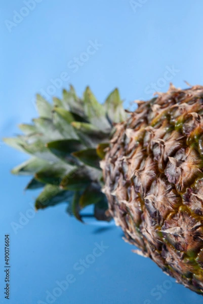 Obraz Pineapple on a blue background. close-up view