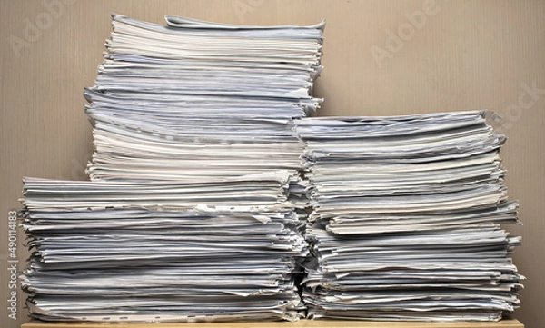 Fototapeta pile of paper documents in the office, paper trash, waste paper