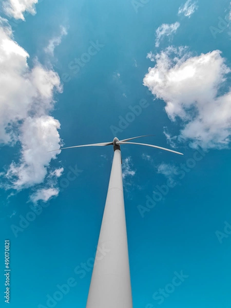 Fototapeta wind turbine against blue sky