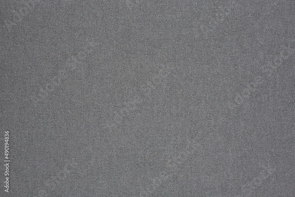 Fototapeta Horizontal flat lay close up of textured black fabric book cover.