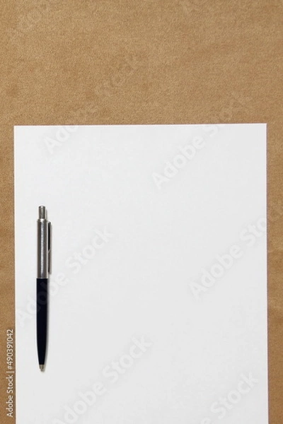 Obraz Template of white paper with pen lies on light brown cloth background. Concept of business plan and strategy. Stock photo with empty space for text and design.