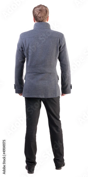 Fototapeta Back view of handsome business man in coat