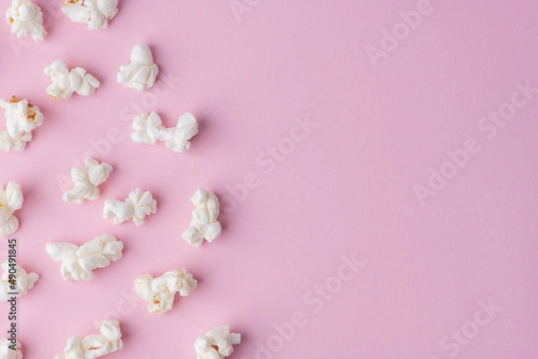 Fototapeta Popcorn on pink background texture