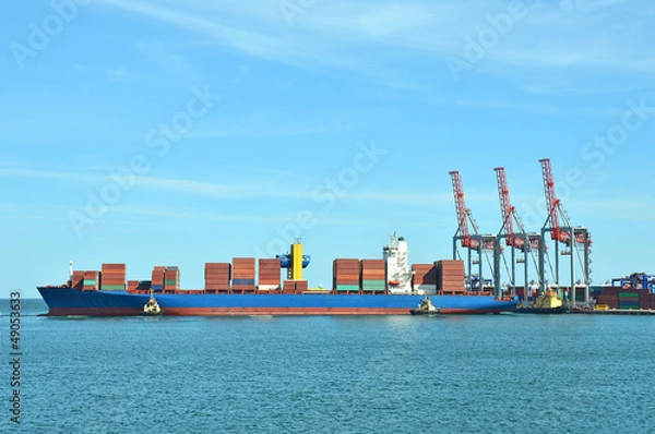 Obraz Container stack and ship under crane bridge