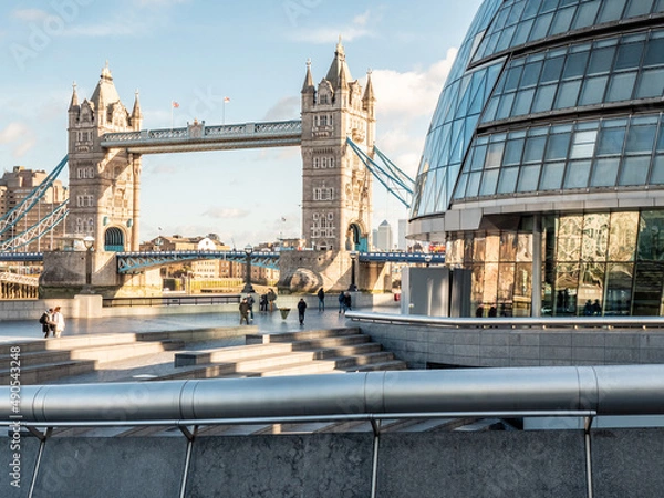 Fototapeta Tower Bridge and City Hall. London. Famous landmarks captured from within the contemporary More London district on the south of the River Thames.