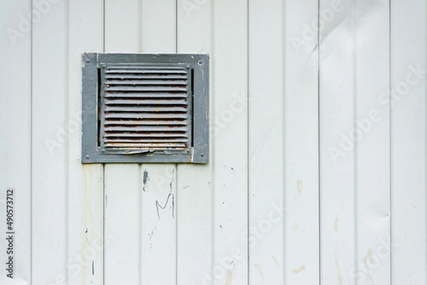 Obraz The texture of a metal wall with a ventilation grate