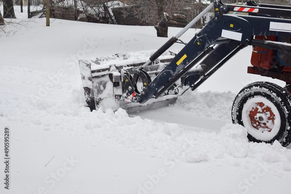 Fototapeta Tractor clearing snow