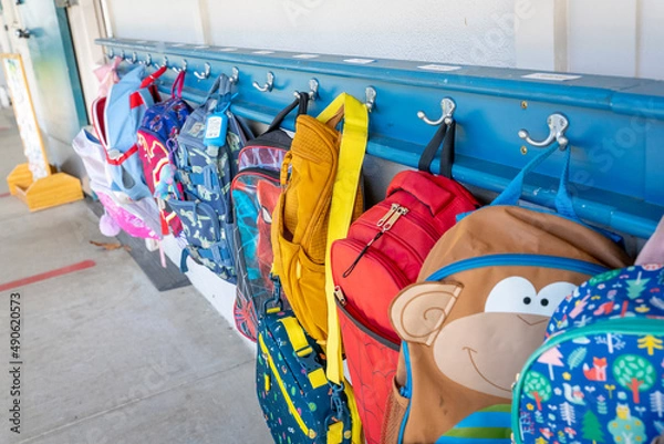 Fototapeta Classroom backpacks on Hooks outside of class