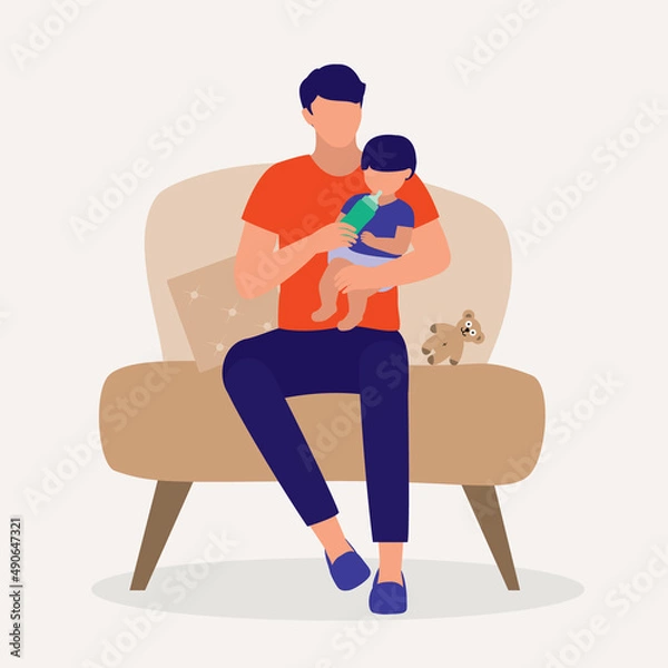 Obraz Father Sitting On A Sofa Chair While Bottle Feeding His Baby.