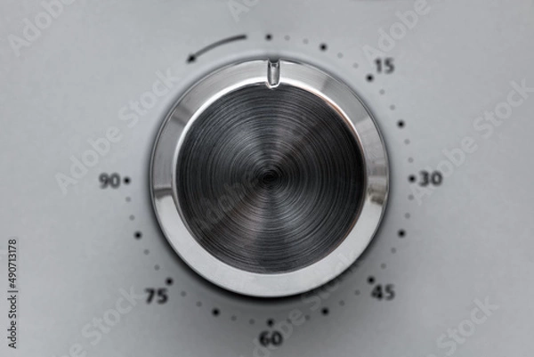 Obraz Close-up Circular button to control the temperature in the microwave oven. Button to warm food on gray background