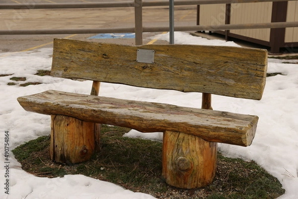 Fototapeta Split log work park bench in the winter