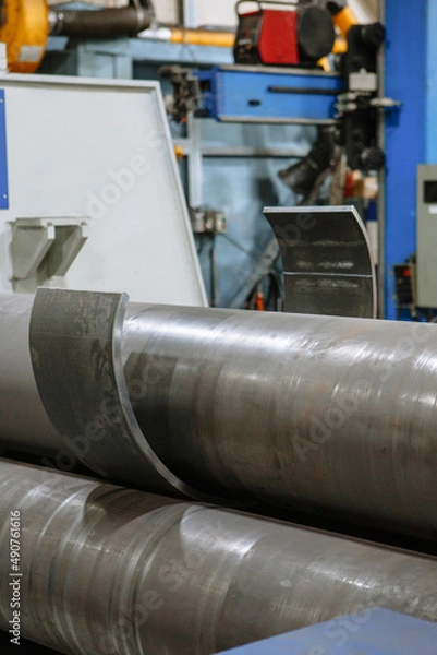 Obraz A sheet of iron that passes through the bending machine. Automation