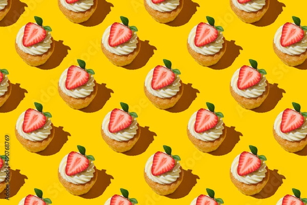 Obraz Pattern made of home cookies with strawberries and cream. cupcake with big strawberry on top. Repeating  homemade cookies with strawberries and cream pattern. Flat lay style.