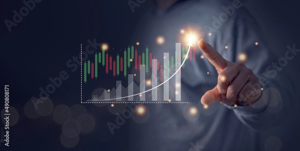 Fototapeta Business growth, Businessman finger touch a growing virtual hologram stock bar chart. Stock trading platform concept. professional financial. Stock market data candlesticks.