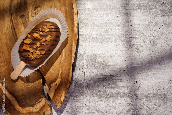 Fototapeta Homemade cookies with raisins, chocolate, nuts and milk on a wooden table and a art background with window light. Breakfast. Close up.
