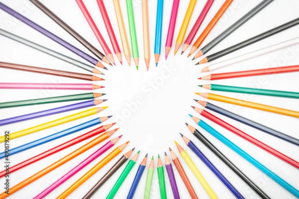 Fototapeta Colored pencils for drawing on a white background. Education and creativity. Leisure and art