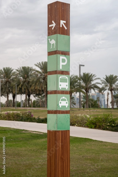 Obraz A camel on a sign showing transport options in a middle eastern public park in Doha, Qatar