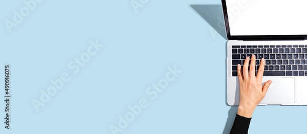 Fototapeta Person using a laptop computer from above