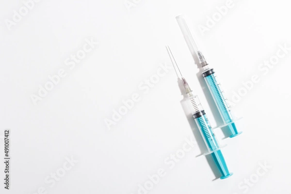 Obraz Medical syringe on a white background. A syringe for injection. The concept of health and beauty