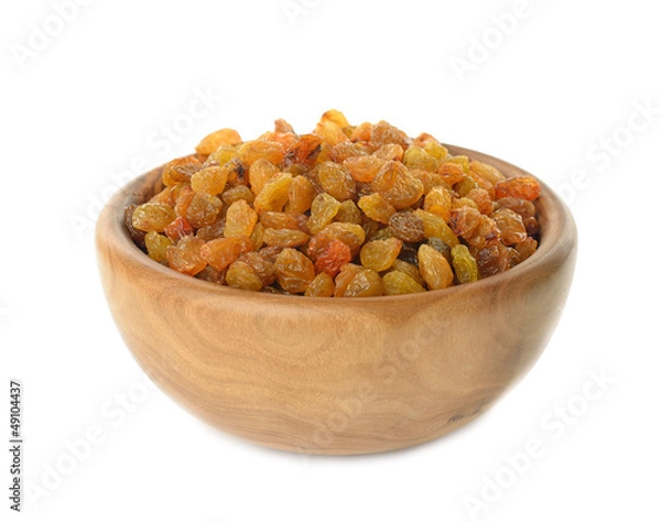 Obraz Raisins in a wooden bowl on a white background
