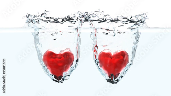 Fototapeta Two red hearts falling into water