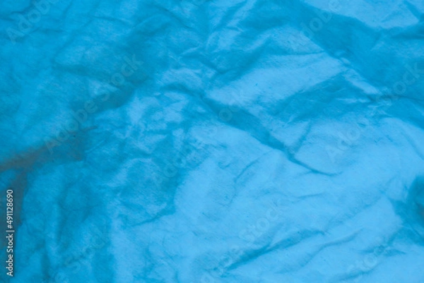 Obraz Blue crumpled paper background.