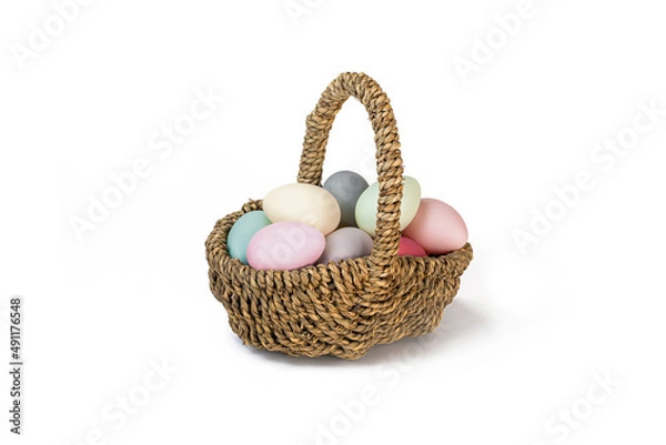 Obraz Easter Egg Basket with multicolored Eggs isolated on a white background. Easter eggs pastel colours.