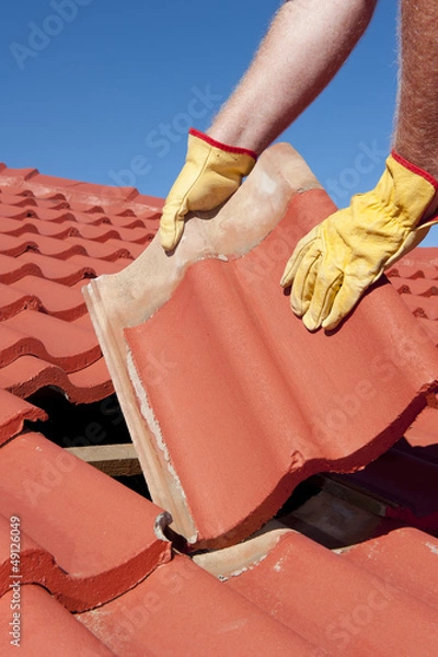 Obraz Construction worker tile roofing repair