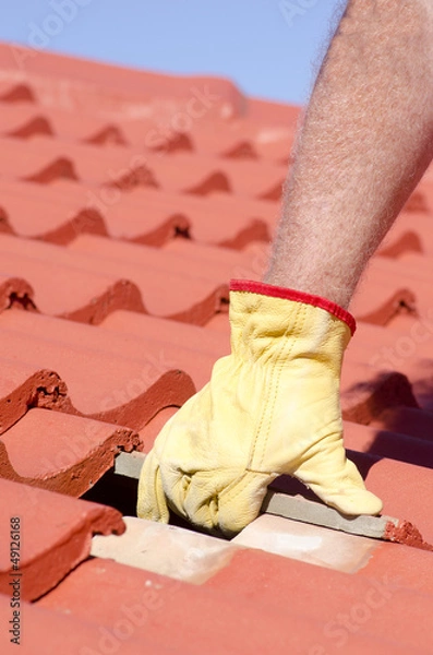 Obraz Construction worker tile roofing repair