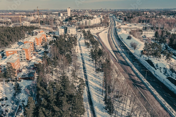 Fototapeta Aerial view of the highway and intersection in the city on a winter day