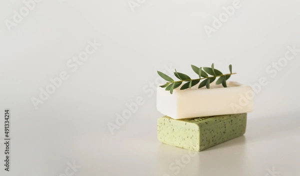 Obraz Natural handmade soap or dry shampoo organic spa bars on light white background. Homemade beauty products with natural essential oils and plants extracts. Copy empty space.