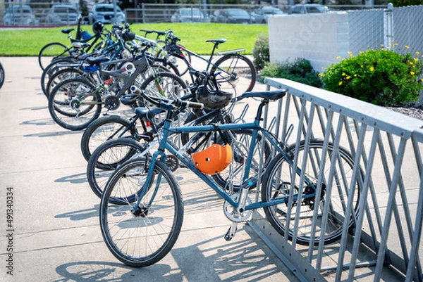Obraz Bicycles in a rack at school, yard