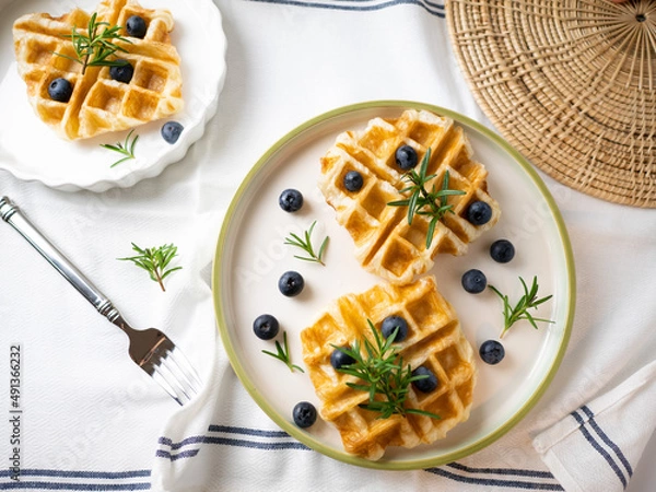 Fototapeta Delicious homemade waffle toping with blueberries