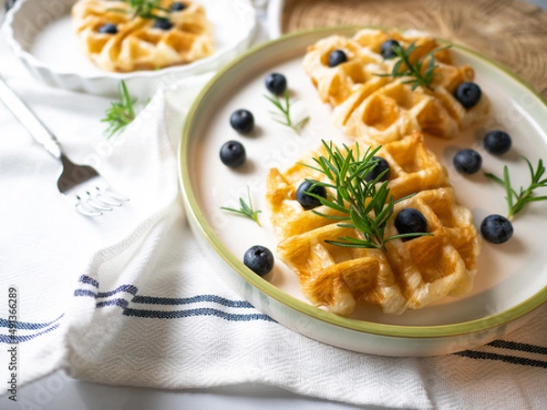 Fototapeta Delicious homemade waffle toping with blueberries
