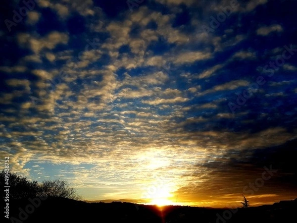 Obraz Sunset in a cloudy day