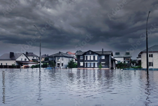 Fototapeta Extreme heavy rain storm weather. Flooded streets of the neighborhood. A flooded road junction with a drowned house. Heavy rains from tropical storm caused many flooded areas. Rains caused many floods