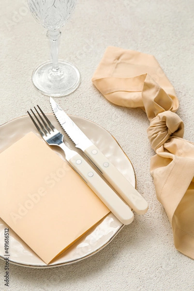 Fototapeta Simple beautiful table setting on light background