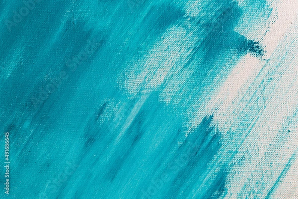 Fototapeta creative background, a spot of heavenly colored primer rubbed on the surface of a linen canvas, temporary object, close, toning