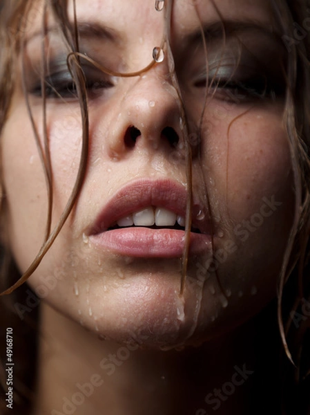 Obraz Portrait of a girl's face which water flows