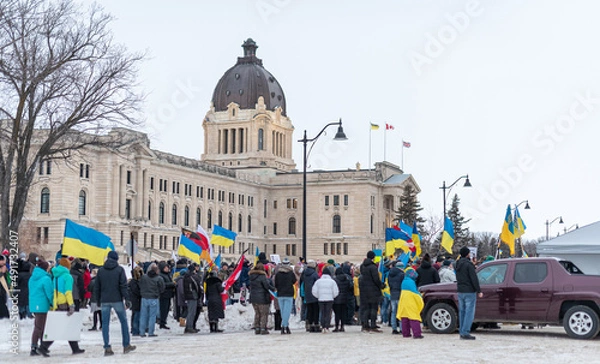 Obraz group of people on the street with Ukrainian flags at the anti-war demonstration in Regina, Saskatchewan, Canada.