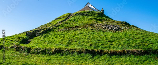 Obraz Carnac,France;February 26, 2022: Neolithic Tumulus of Saint Michel, site located in Morbihan in Brittany, the town is known for its alignments of 2,934 menhirs.