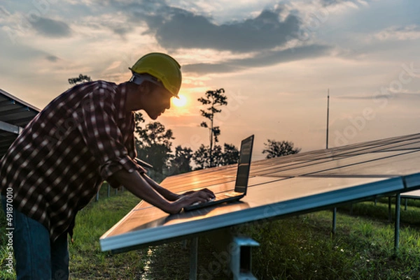 Fototapeta Solar panels with technicians.