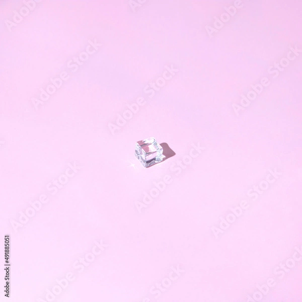 Fototapeta Ice cubes  on pastel pink background. Minimal summer drink concept. 